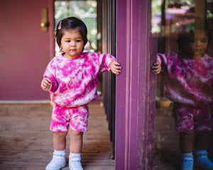 Kids fuchsia pink tie dye sweater and shorts. 