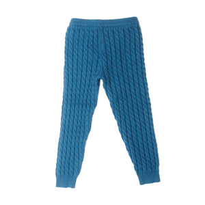 Blue cable knit pants back product shot.