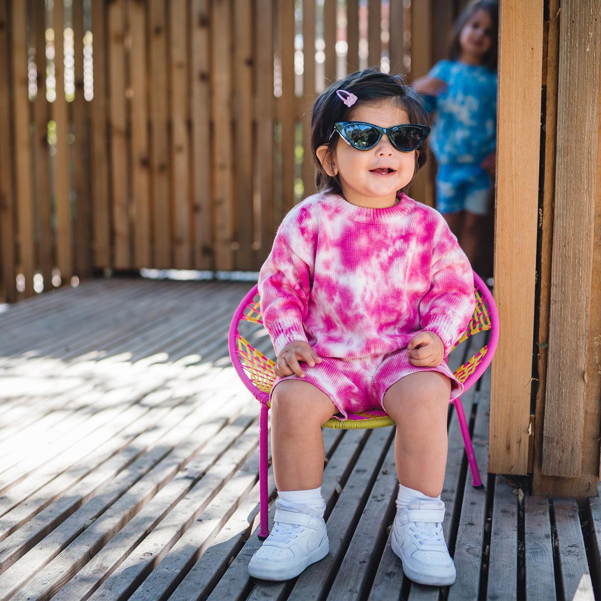 Kids fuchsia pink tie dye sweater and shorts. 